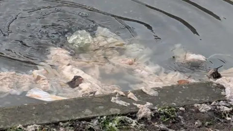 Alaina Gallacher Waste items in flooding in Warwick Road, Whetstone, Leicestershire
