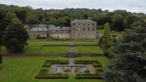 Salloway Property Consultants Drone view of the rolling front lawn and house 