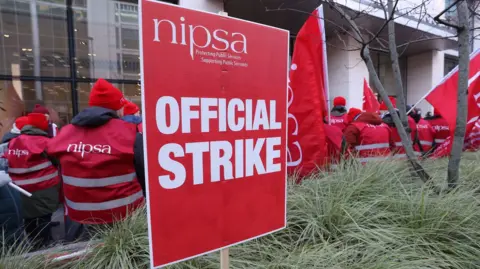 PA Media Public sector workers from Northern Ireland Public Service Alliance (NIPSA) on strike