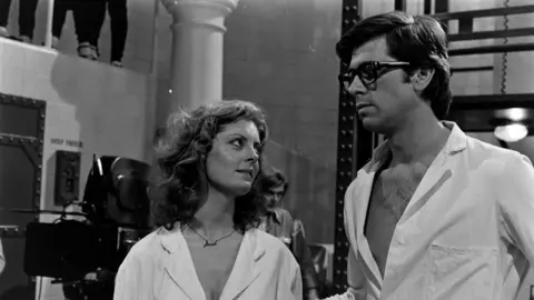 Getty Images Susan Sarandon (left) and Barry Bostwick prepare for filming during production of The Rocky Horror Picture Show at Bray Studios in the county of Berkshire, England.