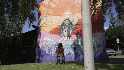 Dawid Wojtowicz/BBC Lavz sat outside Marsh House