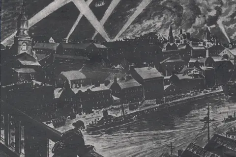 Marshall Forster Atkinson A black and white piece of art of a World War Two scene. A soldier is standing on a bridge and looking down at the River Tyne bordered by buildings. Search lights and smoke are depicted in the night sky.