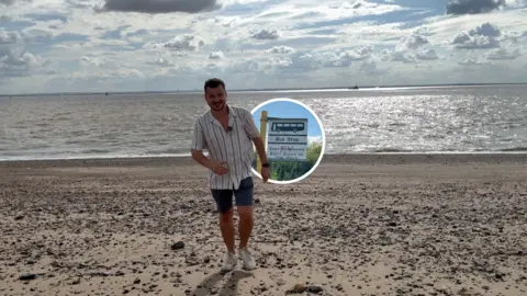 A presenter stands on the pebbled shore at Spurn Point, with the Humber Estuary stretching into the distance behind, while an inset image highlights a bus stop sign to illustrate how visitors can reach the nature reserve using the Spurn Explorer service.