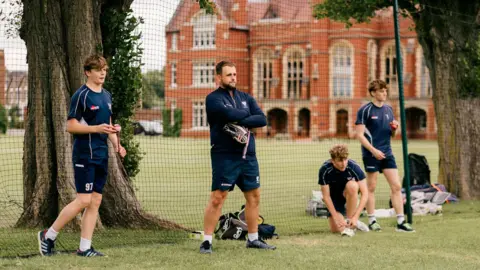 NCCC Charlie Thurston and former NCCC player coaching boys at Bedford School
