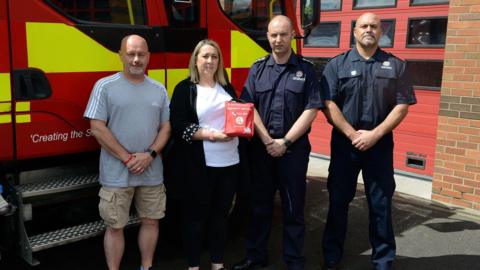 Representatives from the Connor Brown Trust and the Tyne and Wear Fire and Rescue Service holding a bleed kit