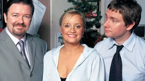 Picture shows (from left) Ricky Gervais as David Brent, Lucy Davis as Dawn and Martin Freeman as Tim in the Christmas Special of The Office in 2003