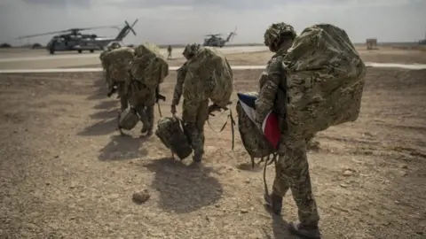 Ben Birchall/PA Wire British troops leaving Afghanistan in 2014