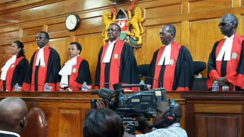 AFP Judges stand to deliver their verdict at the Supreme Court in Nairobi on September 1, 2017, ordering a new presidential election within 60 days after cancelling after cancelling the results of last month's poll.