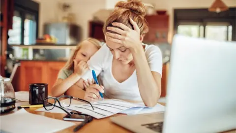 Getty Images A working mother