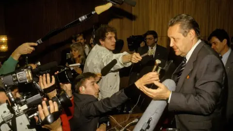 Getty Images An otherwise dull press conference turned to drama on 9 November 1989 when Günter Schabowski spoke of lifting travel restrictions