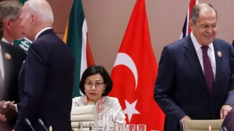 Russian Foreign Minister Sergei Lavrov (R) and US President Joe Biden (3L) attend the G20 Leaders' Summit at the Bharat Mandapam in New Delhi on September 9, 2023.