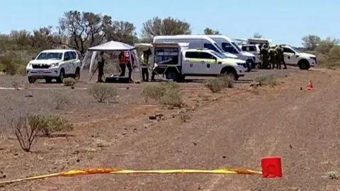 Vehicles in the area where the radioactive capsule was found