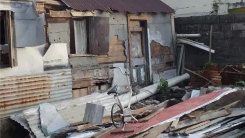 Gemma Handy An exercise bike is the only thing left sanding in this destroyed home in Soufriere.