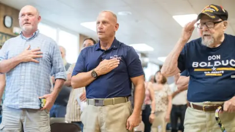 Getty Images Image shows Don Bolduc (centre) with supporters)