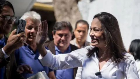 EPA Venezuelan opposition leader Maria Corina Machado greets her followers during a rally in Caracas, Venezuela, 29 January 2024.