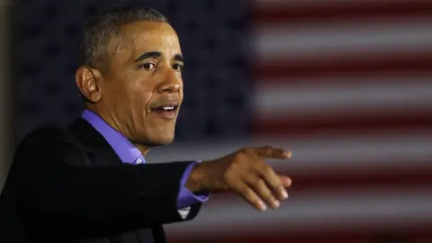 Getty Images Former US President Barack Obama speaks during a campaign rally in Newark, New Jersey on 19 October