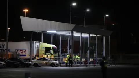 PA Media Trucks pass through a customs post at Dublin Port