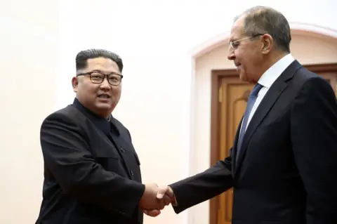 EPA Kim Jong-un (left) greets Sergei Lavrov in Pyongyang, 31 May