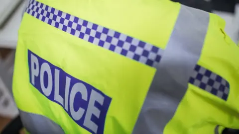 Getty Images A generic image of a police officer's back