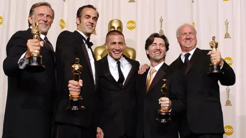 Getty Images Spiderman 2's crew celebrate an Oscar win