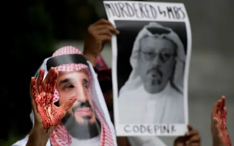 Getty Images A demonstrator dressed as Saudi Arabian Crown Prince Mohammed bin Salman with blood on his hands protests outside the Saudi Embassy in Washington DC, October 2018