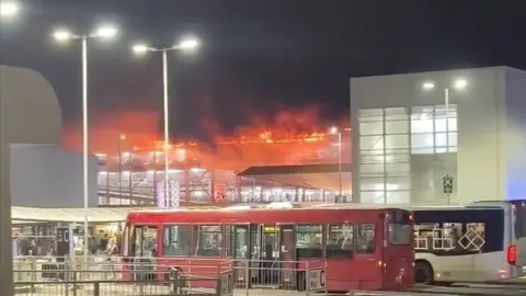 PA Media The fire at Luton Airport