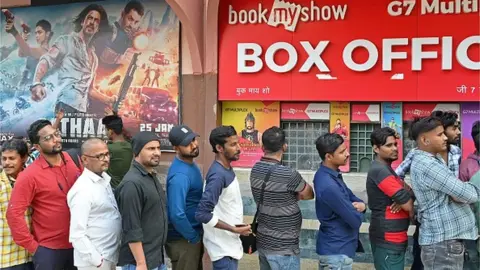 Getty Images Audiences queue up for a film show