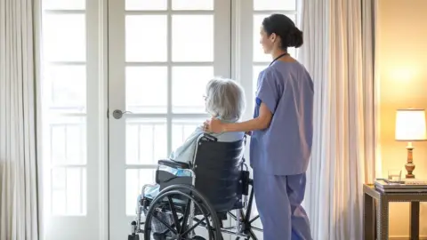 Getty Images/Terry Vine Care home patient and carer