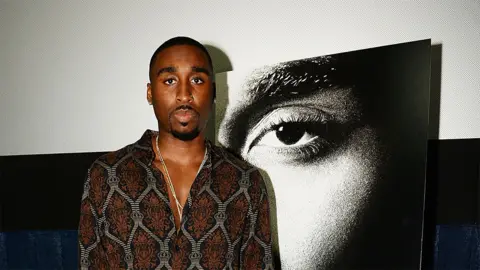 Getty Images Demetrius Shipp Jr, who plays Tupac in the film