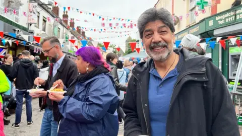 Arif Khan, chair of the council of Bristol mosques enjoying the festivities