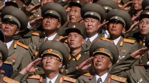 AFP/Getty Korean People's Army (KPA) soldiers salute as they watch a mass rally