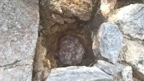 Guernsey Museums/Facebook A cannon ball lodged in a wall