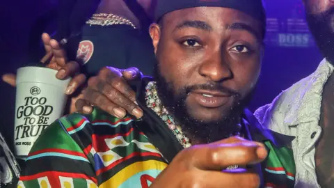 Davido pictured in a club in Miami in the US - 9 March 2024