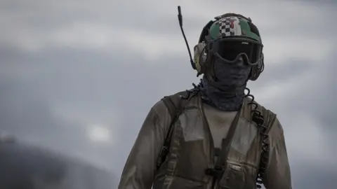 Getty Images Crew member of USS George HW Bush