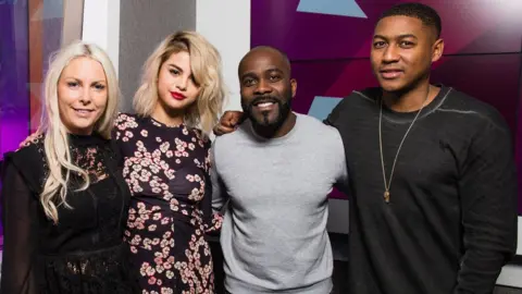 Getty Images Rickie, Melvin and Charlie with Selena Gomez