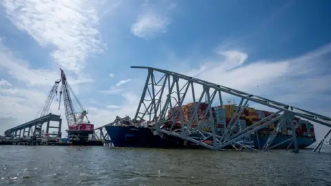 EPA Crews work to remove the wreckage of the Francis Scott Key Bridge atop the cargo vessel Dali in the Patapsco River