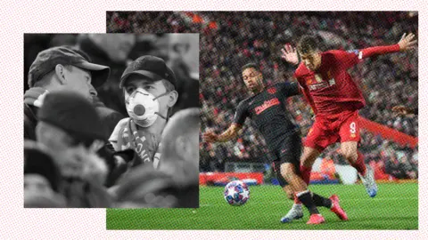 Getty Images Football supporters wearing masks / Liverpool game