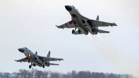 VCG via Getty People's Liberation Army jets during a drill over China, January 2019