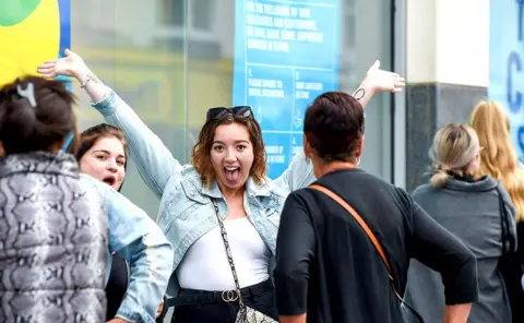 Alamy Live News Shoppers queue for a Primark store