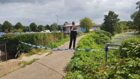 The police cordon near the River Gipping behind Suffolk Retail Park in Ipswich