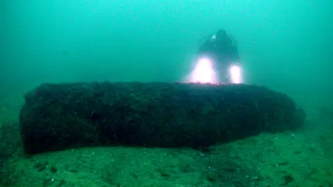 Mark Milburn diver with bomb