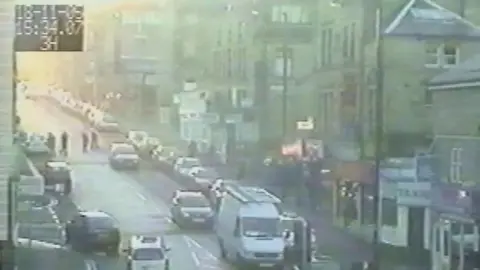 West Yorkshire Police CCTV images showing PCs Sharon Beshenivsky and Teresa Milburn (left) at the scene in Bradford