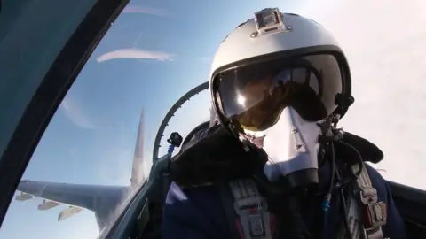 Russian Defence Ministry Pilot flying a Russian fighter jet