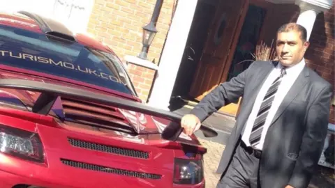 Mohammed Aliaus Aliaus Mohammed with one of his cars