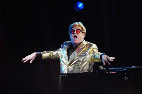 Ben Birchall / PA Media Elton John performing on the Pyramid Stage at the Glastonbury Festival at Worthy Farm in Somerset, 25 June 2023