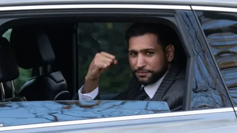 PA Media Mr Khan outside Snaresbrook Crown Court