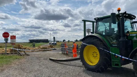 BBC A tractor and freight train collided on a level crossing