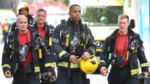 Getty Images Firefighters at scene of Grenfell tower fire