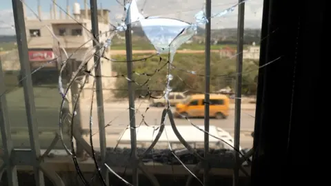 Broken window in the Palestinian town of Hawara, in the occupied West Bank, following an attack by Israeli settlers