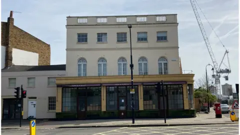 Alison Earle/BBC Exterior of the York & Albany pub. Parts of the windows have been boarded up.